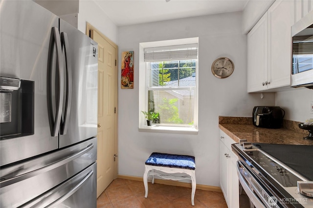2300 Jefferson Ave NE Unit F-126, Renton, WA 98056 - kitchen with appliances with stainless steel finishes, white cabinetry, tile countertops, and light tile patterned floors