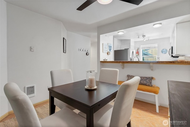 2300 Jefferson Ave NE Unit F-126, Renton, WA 98056 - dining room with ceiling fan and light tile patterned floors