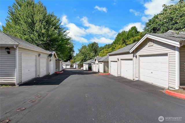 2300 Jefferson Ave NE Unit F-126, Renton, WA 98056 - view of asphalt road featuring community garages
