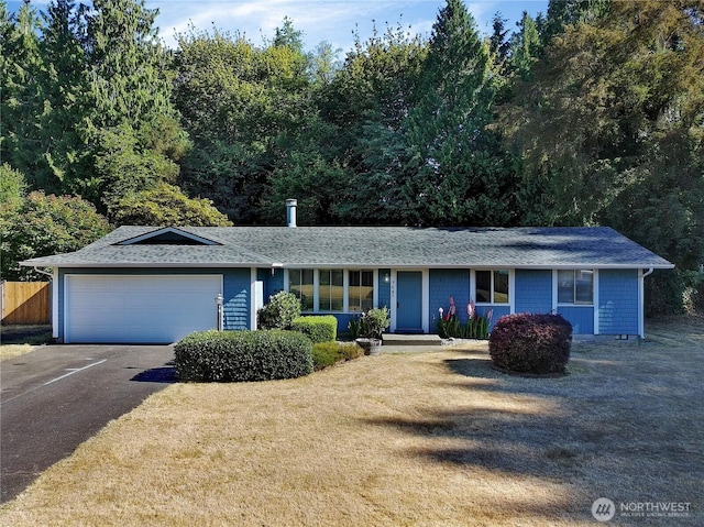 7127 Fair Oaks Loop SE, Olympia, WA 98513 - ranch-style home featuring a garage, roof with shingles, and driveway