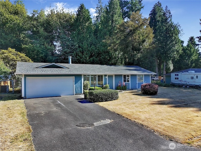 7127 Fair Oaks Loop SE, Olympia, WA 98513 - ranch-style house featuring an attached garage, driveway, a front yard, and a shingled roof