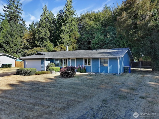 7127 Fair Oaks Loop SE, Olympia, WA 98513 - ranch-style home with an attached garage and driveway