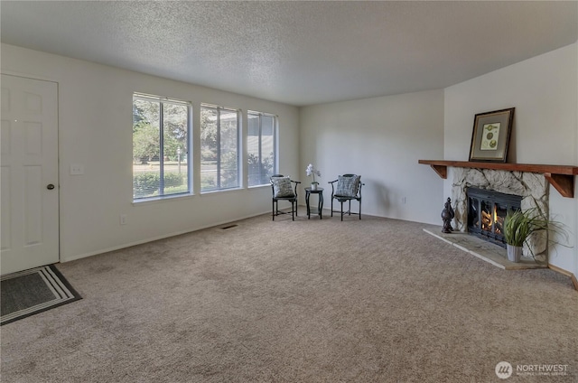 7127 Fair Oaks Loop SE, Olympia, WA 98513 - carpeted living room with a fireplace and a textured ceiling