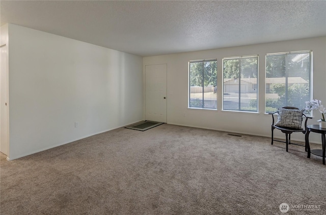7127 Fair Oaks Loop SE, Olympia, WA 98513 - carpeted empty room with a textured ceiling and baseboards