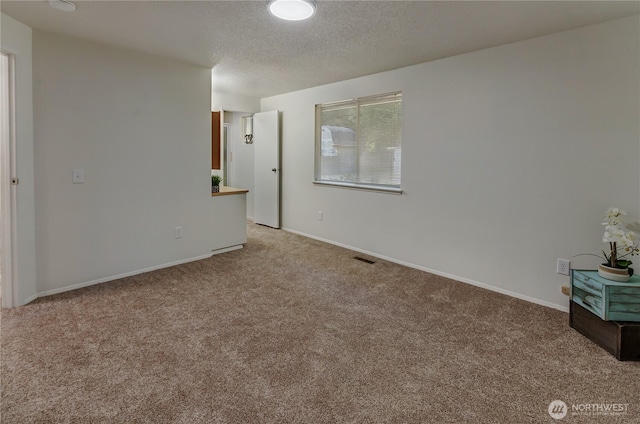 7127 Fair Oaks Loop SE, Olympia, WA 98513 - empty room featuring carpet and a textured ceiling