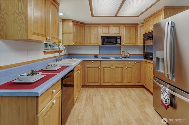 7127 Fair Oaks Loop SE, Olympia, WA 98513 - kitchen featuring black appliances, light wood-style floors, and light countertops