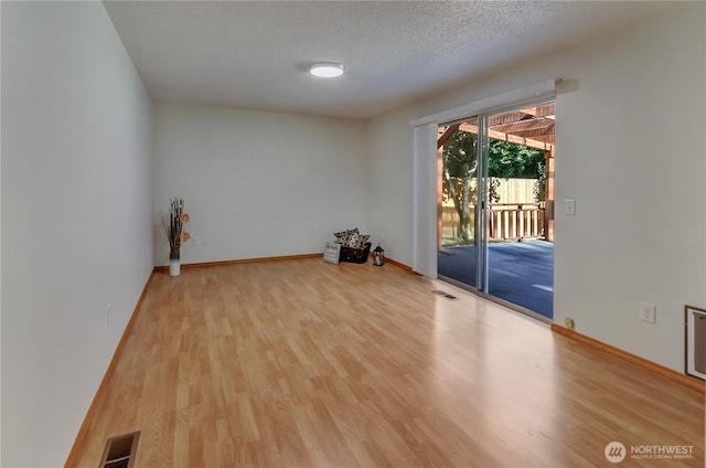 7127 Fair Oaks Loop SE, Olympia, WA 98513 - empty room with wood finished floors and a textured ceiling