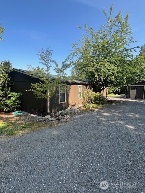 20011 Tveit Rd, Arlington, WA 98223 - view of front of home with driveway and an outdoor structure