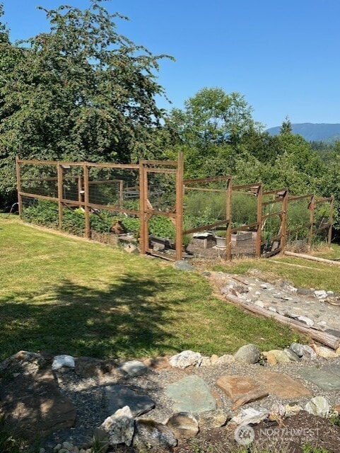 20011 Tveit Rd, Arlington, WA 98223 - view of grassy yard with a garden
