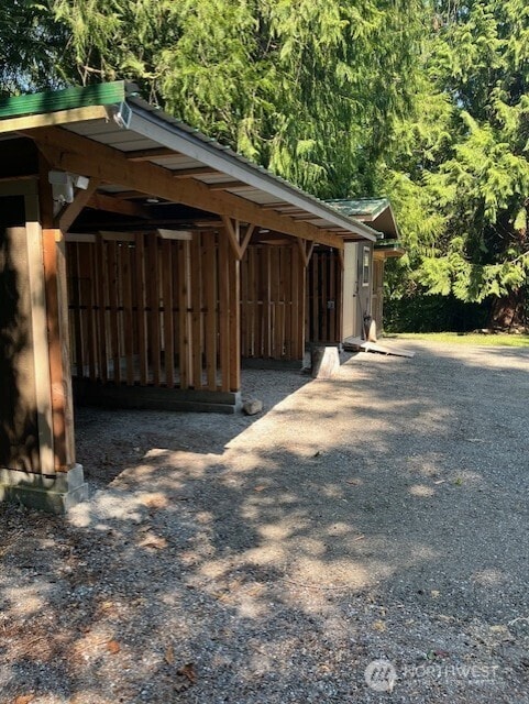 20011 Tveit Rd, Arlington, WA 98223 - view of parking / parking lot with a wooded view