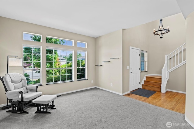 5115 150th St SE, Everett, WA 98208 - living area with a chandelier, stairway, carpet flooring, and wood finished floors
