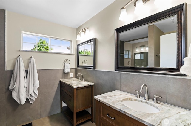 5115 150th St SE, Everett, WA 98208 - full bath with tile walls, two vanities, and a wainscoted wall