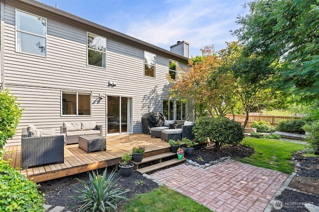5115 150th St SE, Everett, WA 98208 - rear view of house featuring outdoor lounge area, a chimney, a wooden deck, and a patio