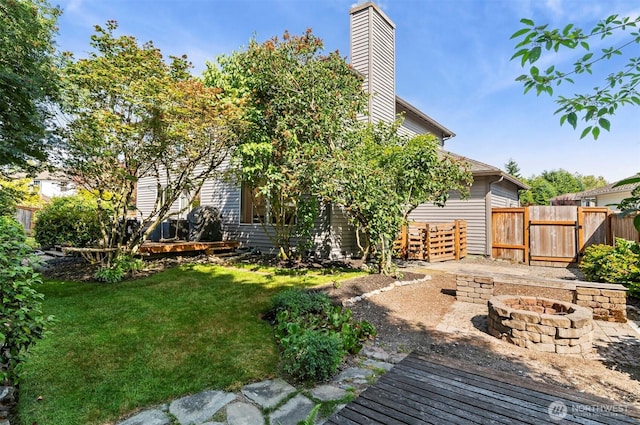 5115 150th St SE, Everett, WA 98208 - view of yard featuring an outdoor fire pit and a gate