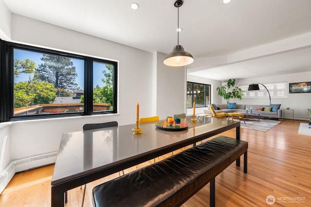 3516 NE 43rd St, Seattle, WA 98105 - dining space with recessed lighting, wood finished floors, and a baseboard radiator
