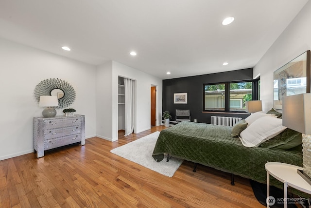 3516 NE 43rd St, Seattle, WA 98105 - bedroom with wood finished floors, radiator, and recessed lighting