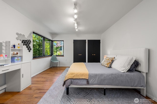 3516 NE 43rd St, Seattle, WA 98105 - bedroom featuring wood finished floors and baseboards