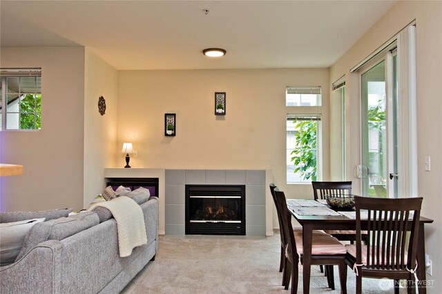 15325 SE 155th Pl Unit K1, Renton, WA 98058 - dining area featuring light carpet and a tiled fireplace