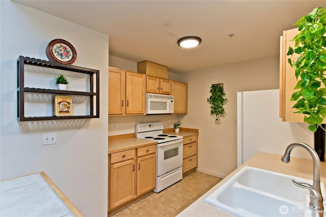 15325 SE 155th Pl Unit K1, Renton, WA 98058 - kitchen with white appliances, light brown cabinetry, and light countertops