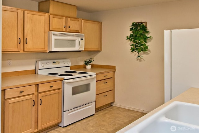 15325 SE 155th Pl Unit K1, Renton, WA 98058 - kitchen with white appliances, light brown cabinets, and light countertops