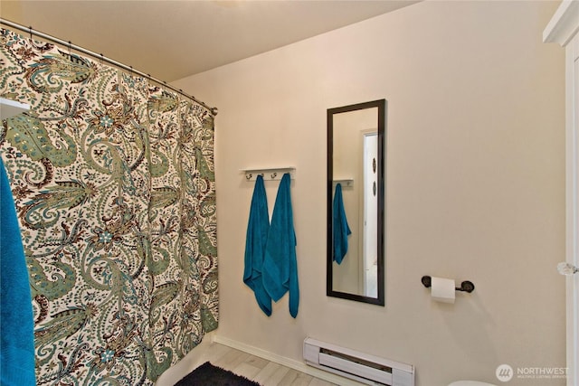 15325 SE 155th Pl Unit K1, Renton, WA 98058 - bathroom featuring a baseboard heating unit and a shower with curtain