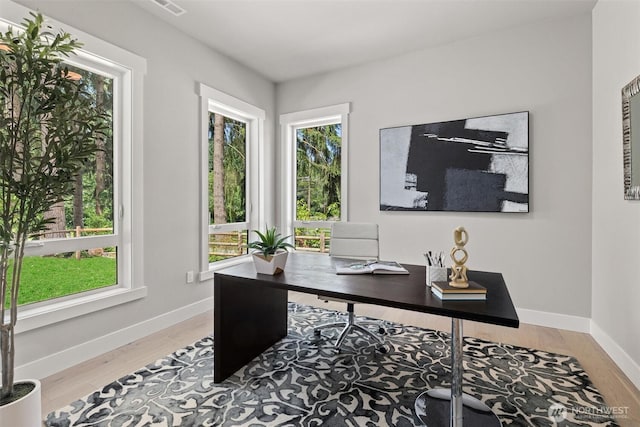 16429 Snohomish Ave SE, Clearview, WA 98296 - home office with plenty of natural light and wood finished floors