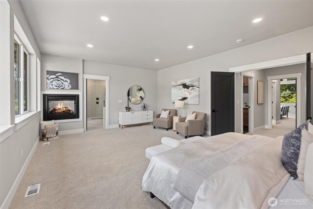 16429 Snohomish Ave SE, Clearview, WA 98296 - bedroom featuring multiple windows, recessed lighting, light colored carpet, and a multi sided fireplace