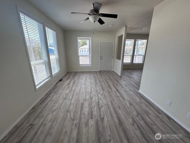 2101 S 324th St Unit 193, Federal Way, WA 98003 - unfurnished living room with wood finished floors and ceiling fan