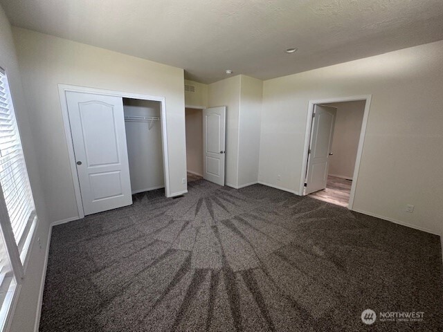 2101 S 324th St Unit 193, Federal Way, WA 98003 - unfurnished bedroom featuring carpet floors and a closet