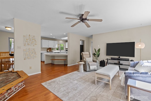 8618 212th St NE, Arlington, WA 98223 - living room with light wood-type flooring, a ceiling fan, and recessed lighting