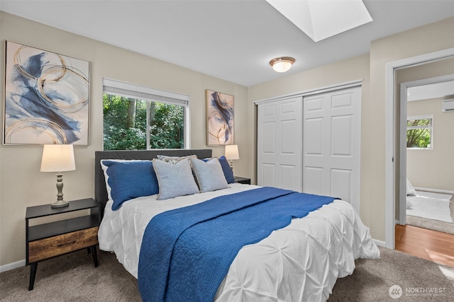 8618 212th St NE, Arlington, WA 98223 - bedroom with a skylight, multiple windows, carpet floors, and a closet