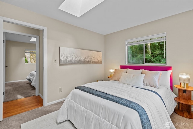 8618 212th St NE, Arlington, WA 98223 - carpeted bedroom featuring a skylight and baseboards