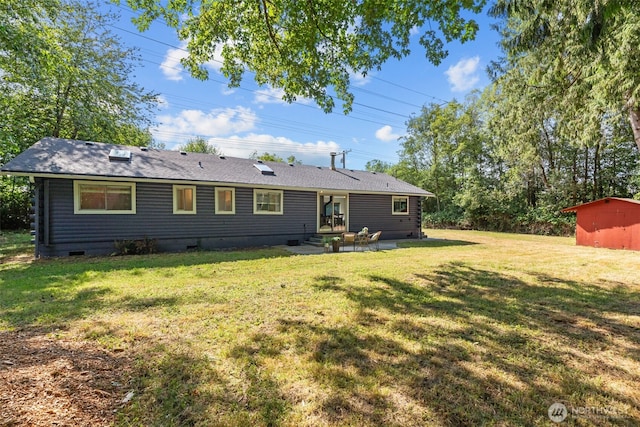 8618 212th St NE, Arlington, WA 98223 - rear view of house with crawl space, a patio, and a yard