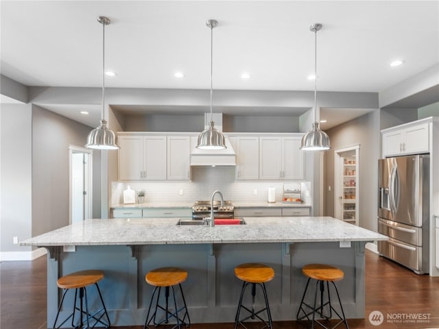 2038 Maiden Ln, Wenatchee, WA 98801 - kitchen with stainless steel fridge, dark wood finished floors, decorative backsplash, white cabinetry, and recessed lighting