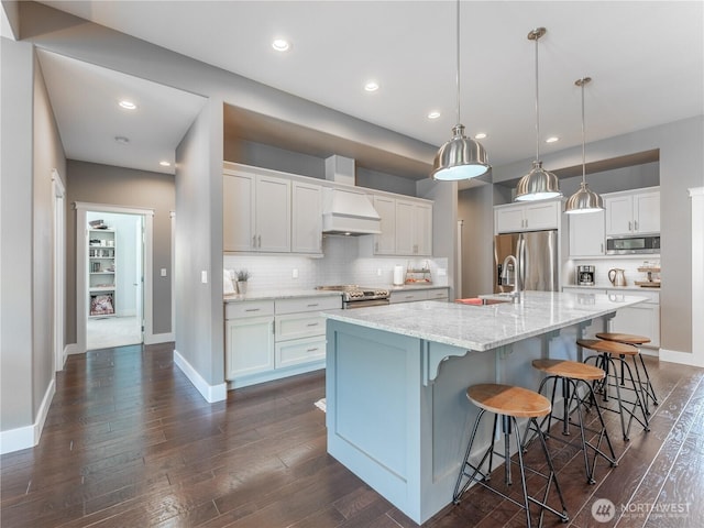 2038 Maiden Ln, Wenatchee, WA 98801 - kitchen featuring appliances with stainless steel finishes, white cabinetry, dark wood-type flooring, tasteful backsplash, and recessed lighting