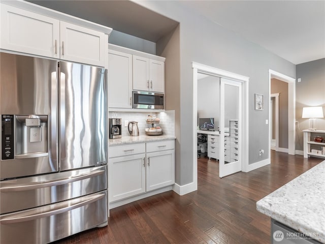 2038 Maiden Ln, Wenatchee, WA 98801 - kitchen with stainless steel appliances, dark wood finished floors, backsplash, and white cabinetry