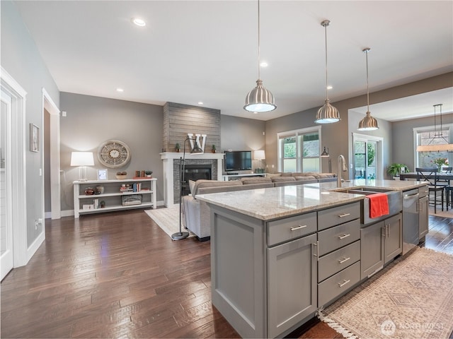 2038 Maiden Ln, Wenatchee, WA 98801 - kitchen with gray cabinets, dishwasher, a glass covered fireplace, dark wood finished floors, and recessed lighting