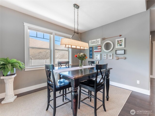 2038 Maiden Ln, Wenatchee, WA 98801 - dining space with baseboards and wood finished floors
