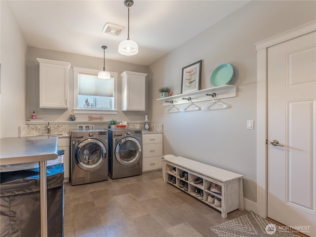 2038 Maiden Ln, Wenatchee, WA 98801 - laundry area featuring cabinet space and washer and clothes dryer