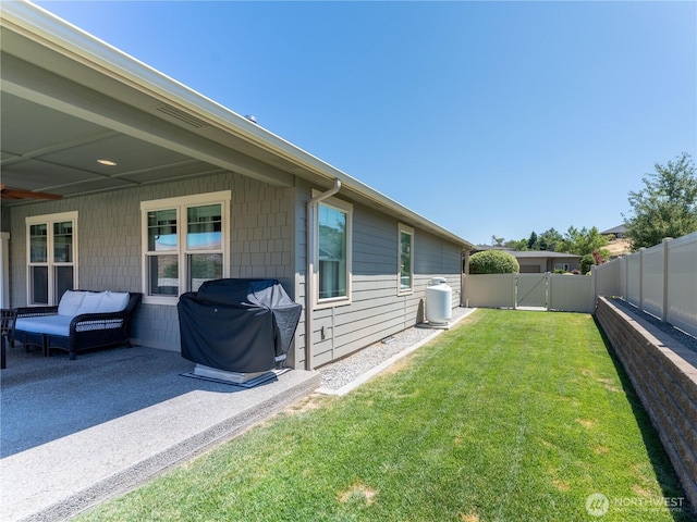 2038 Maiden Ln, Wenatchee, WA 98801 - fenced backyard with a gate and a patio