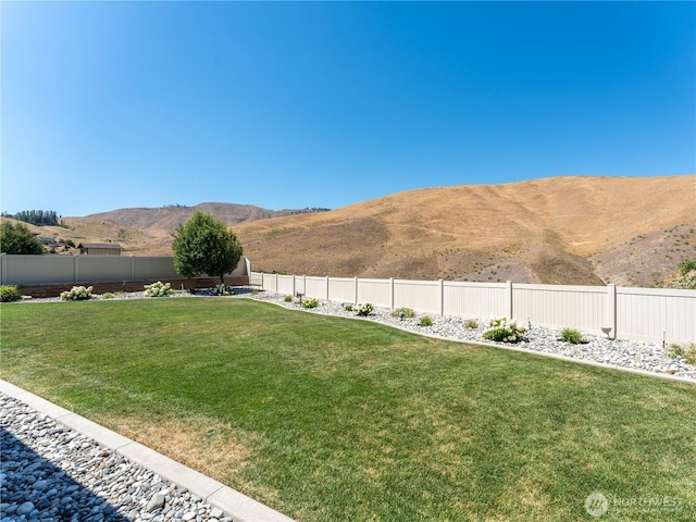 2038 Maiden Ln, Wenatchee, WA 98801 - fenced backyard with a mountain view
