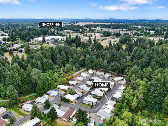1841 Trosper Rd SW Unit 24, Tumwater, WA 98512 - aerial view of property and surrounding area featuring a forest and a mountain backdrop