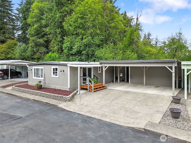 1841 Trosper Rd SW Unit 24, Tumwater, WA 98512 - view of front facade featuring a carport and driveway