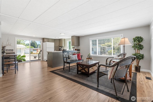 1841 Trosper Rd SW Unit 24, Tumwater, WA 98512 - living room with healthy amount of natural light, light wood-type flooring, and recessed lighting