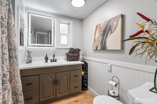 1841 Trosper Rd SW Unit 24, Tumwater, WA 98512 - full bath with vanity, a wainscoted wall, and wood finished floors