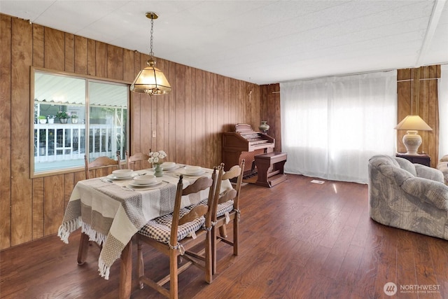 4015 Eliza Ave Unit 47, Bellingham, WA 98226 - dining space featuring plenty of natural light, wood walls, and dark wood-style flooring