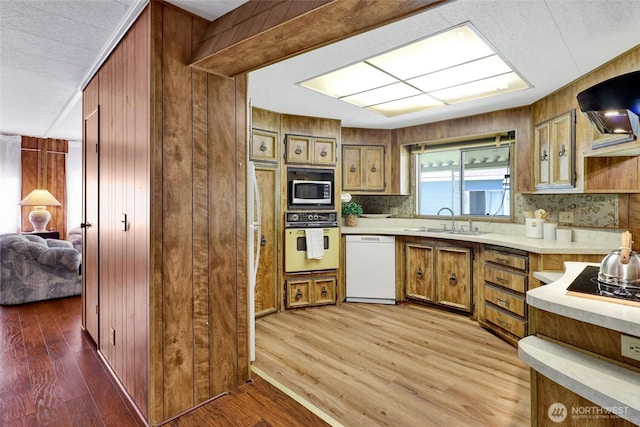 4015 Eliza Ave Unit 47, Bellingham, WA 98226 - kitchen featuring white appliances, light countertops, backsplash, and wooden walls