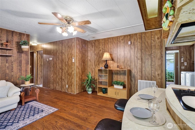 4015 Eliza Ave Unit 47, Bellingham, WA 98226 - living room featuring wood walls, ceiling fan, and wood finished floors