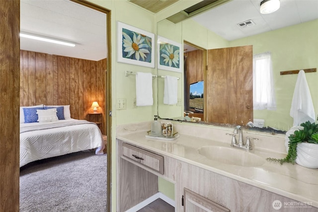 4015 Eliza Ave Unit 47, Bellingham, WA 98226 - bathroom with connected bathroom, vanity, and wood walls