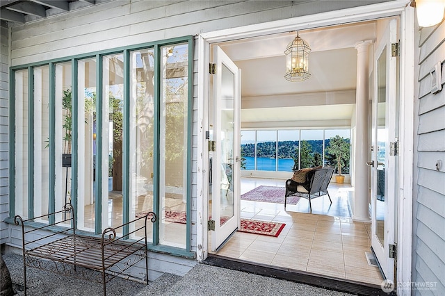3719 NE 145th St, Seattle, WA 98155 - doorway to outside with a chandelier, wooden walls, and a water view
